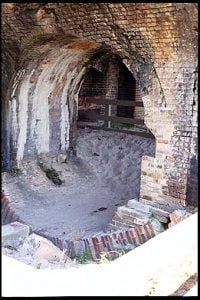The difficulty of building on sand provided a challenge for the military engineers who were attempting to build Fort Pickens. One feature designed to prevent it from sinking into the sand was the use of a reverse arch as the foundation for the walls of the casemates. This view shows a reverse arch, which has been excavated to illustrate this structure.