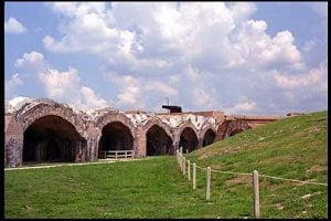 This view shows the western bastion from inside the fort. The cannon emplaced on the bastion is a 15-inch Rodman, similar to a weapon emplaced there in 1868. In the foreground are more casemates, modified when the Endicott period Battery Pensacola was installed within the walls of Fort Pickens.